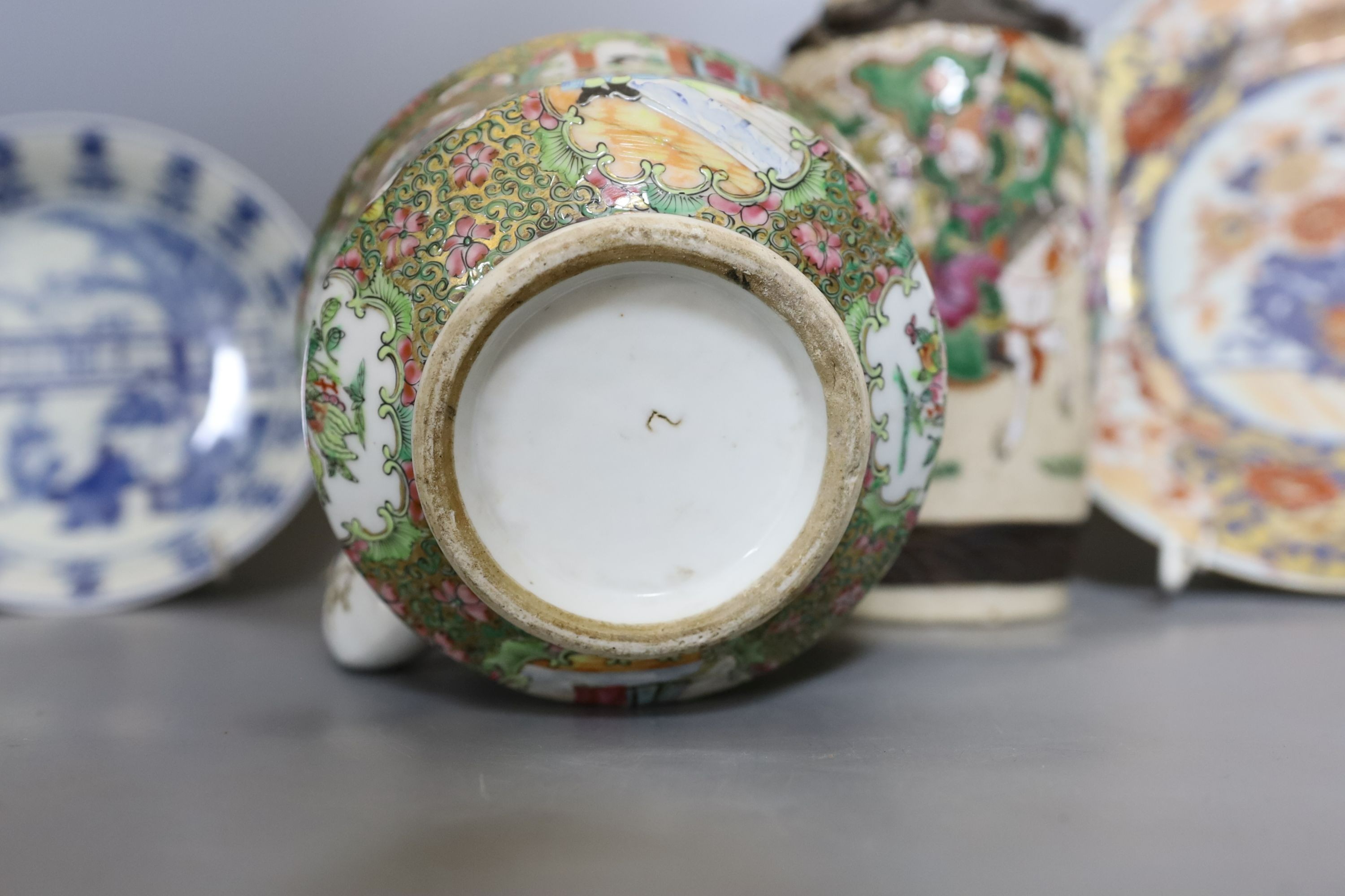 Three Chinese plates including a 19th century Chinese Imari dish, 23cm - repaired, a Chinese famille rose crackleglaze vase, 29cm, together with a famille rose teapot and a crackleglaze celadon ground bottle vase. Talles